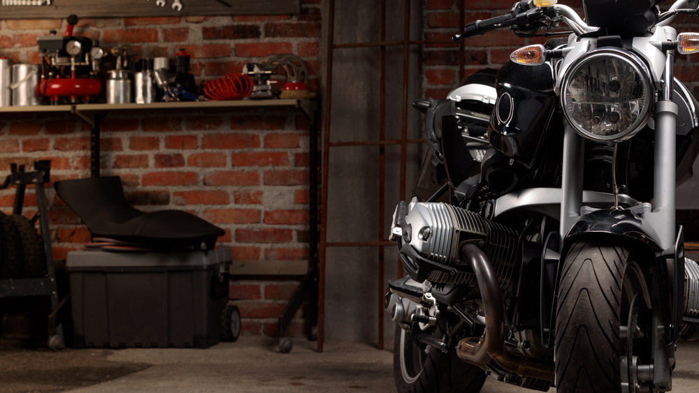 motorcycle wiring specialist in Cheltenham and Gloucestershire black custom motorcycle in dark garage